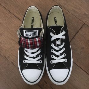 Black converse with red plaid detail.